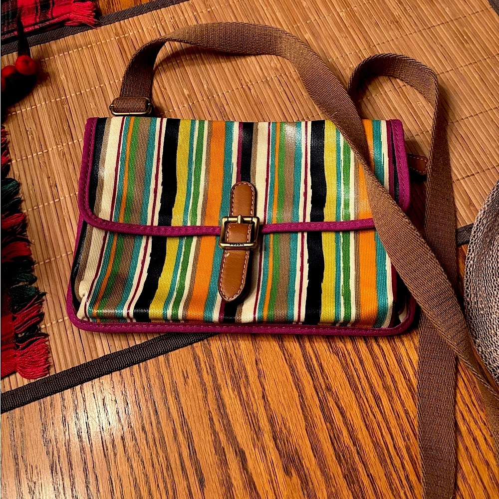 Fossil Small Crossbody purse. Colorful stripe wipeable finish and snap closure.